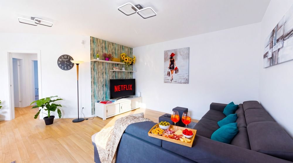 Zona salotto con Smart TV nell'appartamento nel centro di Iseo