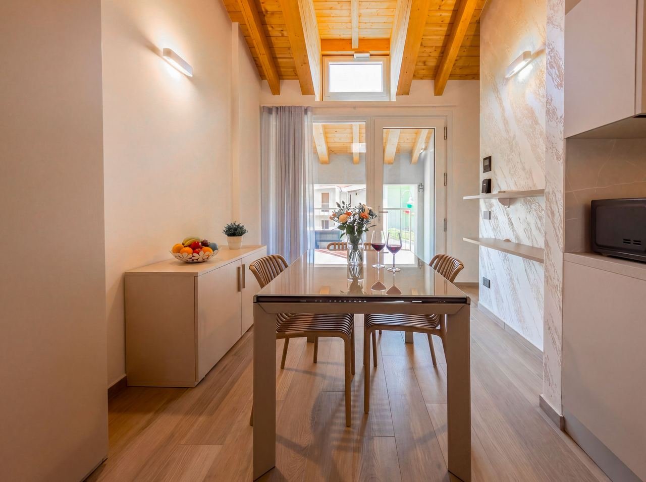 Studio 13: dining area opening onto the balcony