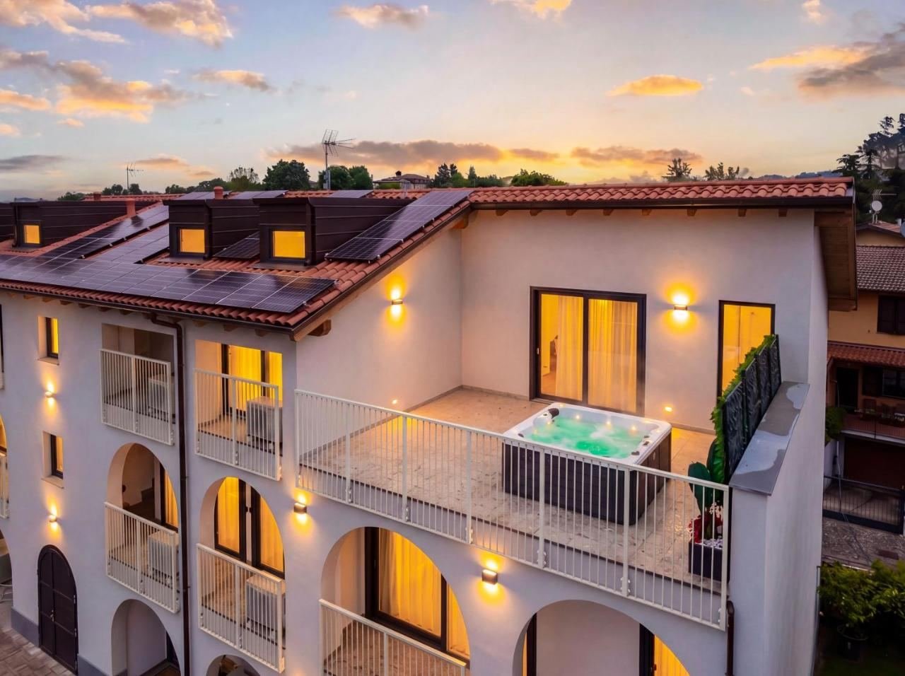 Rooftop panoramic terrace of the residence with a jacuzzi, overlooking Lake Iseo
