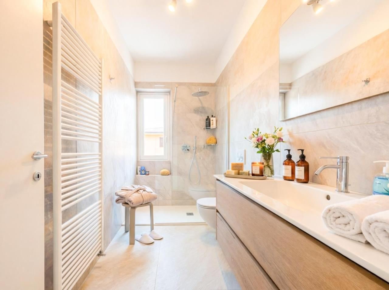 Spacious bathroom with a double shower and double basin